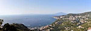 a view of a town on a hill next to the ocean at Il Profumo di Capri in Massa Lubrense