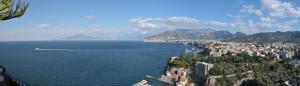 a large body of water with a city at Il Profumo di Capri in Massa Lubrense