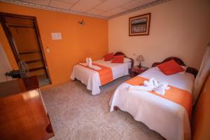 Voodi või voodid majutusasutuse Hostal Gladismar toas
