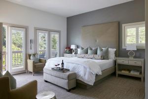 a bedroom with a large bed and a large window at SENZA Hotel in Napa