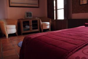 Кровать или кровати в номере Hostería de la Galería Cerdán