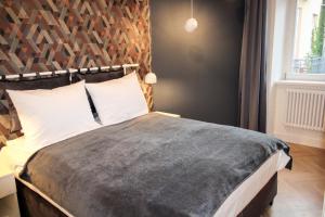 Łóżko lub łóżka w pokoju w obiekcie Dominican Square by Hashtag Apartments