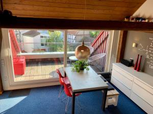 a room with a table and a view of a balcony at Historische Ferienwohnung mit Sauna in Lich in Lich