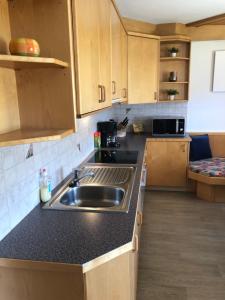 a kitchen with a sink and a counter top at Haus Fuetsch in Virgen