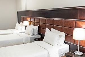 Llit o llits en una habitació de Le Bosphorus Hotel Two