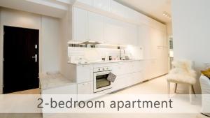 Kuchyň nebo kuchyňský kout v ubytování White Apartments with AC by Kovee