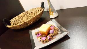 a table with a plate of food and a basket at Art House Plovdiv in Plovdiv