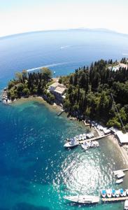 an aerial view of an island with boats in the water at Maria Corfu Loustri in Corfu