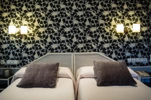 Postel nebo postele na pokoji v ubytování Hostal Paris