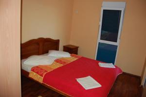 En eller flere senge i et værelse på villa elkom-appartamento giallo 1