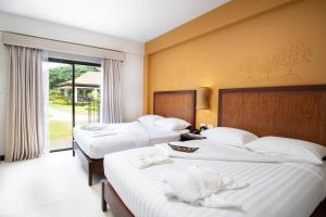 Postel nebo postele na pokoji v ubytování Bacau Bay Resort Coron