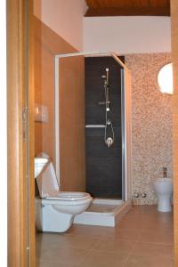 a bathroom with a toilet and a shower at Relax in Vieste