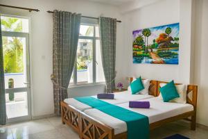 Кровать или кровати в номере Di Sicuro Tourist Inn