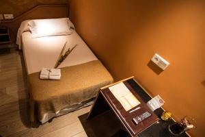 Postel nebo postele na pokoji v ubytování Hostal Paris