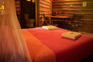 Postel nebo postele na pokoji v ubytování Ecolodge Cosmogénesis
