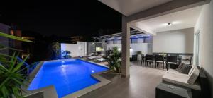 a swimming pool in the middle of a house at Villa Palladium in Makarska