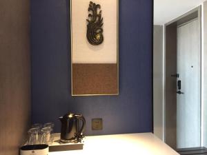 Postel nebo postele na pokoji v ubytování Tian Yi International Hotel 天艺国际酒店
