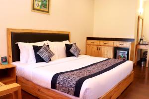 Letto o letti in una camera di Hotel SunGrace