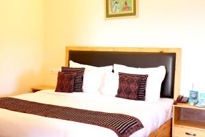 Letto o letti in una camera di Hotel SunGrace