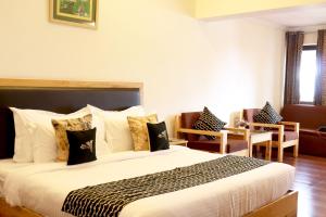 Letto o letti in una camera di Hotel SunGrace