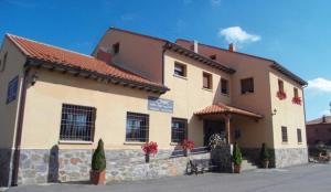 a large building with a sign in front of it at La Ventana De Tejera Negra in Cantalojas