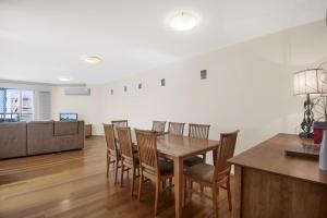 a dining room with a table and chairs at Breakwater Views by Kingscliff Accommodation in Cabarita Beach