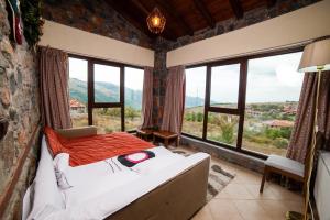 Ένα ή περισσότερα κρεβάτια σε δωμάτιο στο Ξενώνας Εύα