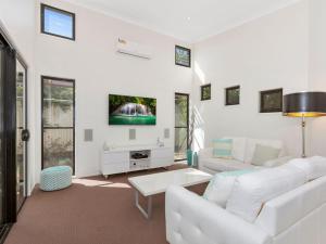 A seating area at Casuarina Escape by Kingscliff Accommodation