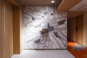 a wall mural in a hallway with a map at Shibuya Tokyu REI Hotel in Tokyo