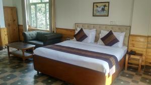 Postel nebo postele na pokoji v ubytování Highland Village Resort