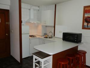 Кухня или кухненски бокс в Apartamentos Turisticos Beatriz