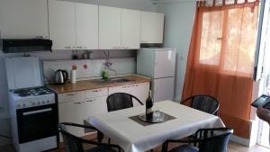 Kuchyň nebo kuchyňský kout v ubytování Apartments Zovko