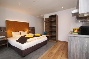 Postel nebo postele na pokoji v ubytování Lärchenheim Apartments