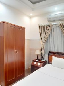Postel nebo postele na pokoji v ubytování Binh An Hotel