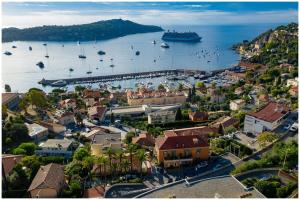 an aerial view of a harbor with boats in the water at Hôtel La Flore in Villefranche-sur-Mer