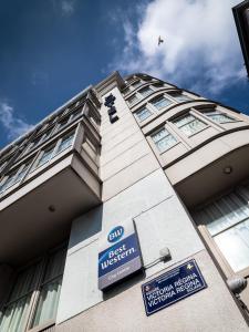 a building with a sign in front of it at Hotel Best Western City Centre in Brussels
