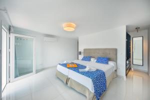 Postel nebo postele na pokoji v ubytování Globales Villa Gardenia + 10 fotografií