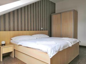 Ένα ή περισσότερα κρεβάτια σε δωμάτιο στο Apartments Nostro