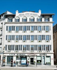 a large white building with a hotel core escape at Hotel Cote Basque in Bayonne