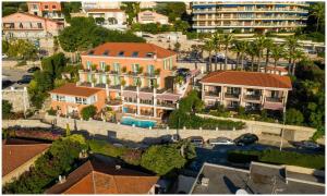 an aerial view of a building in a city at Hôtel La Flore in Villefranche-sur-Mer