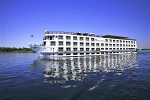 a large white cruise ship on the water at Jaz Crown Jewel Nile Cruise - Every Saturday from Luxor for 07 & 04 Nights - Every Wednesday From Aswan for 03 Nights in Luxor