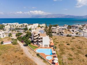 an aerial view of a resort with a swimming pool at Hermes Hotel in Kissamos