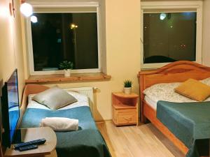 Postel nebo postele na pokoji v ubytování Guest House Kamara
