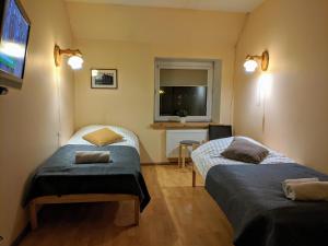 Postel nebo postele na pokoji v ubytování Guest House Kamara