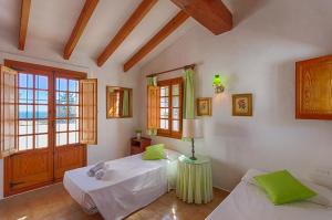 En eller flere senge i et værelse på Villas Guzman - Andurina