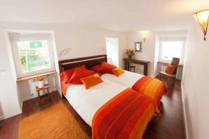 A bed or beds in a room at La Postoca