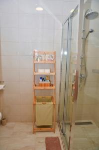 a bathroom with a shower and a glass shower stall at Studio D&T in Slavonski Brod