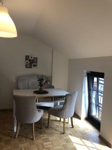 a dining room with a table and two chairs at Altstadt Quartier Hameln in Hameln
