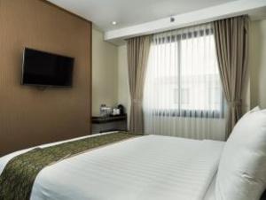 TV a/nebo společenská místnost v ubytování Savvoya Hotel Seminyak