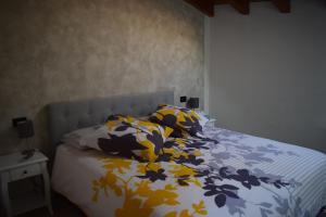 מיטה או מיטות בחדר ב-Appartamento El Cio
